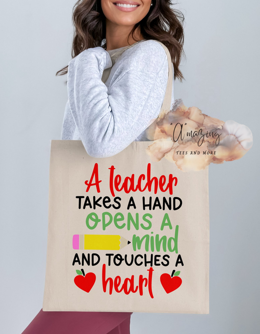 A teacher takes a hand opens a mind and touches a heart Tote bag